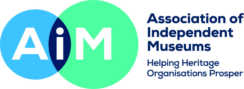 Logo for Association of Independent Museums with the letters AIM in blue and green overlapping circles.