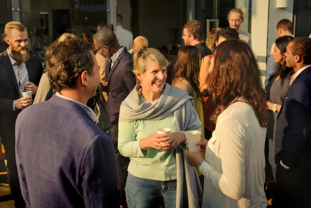 Group of people in conversation. Represent's event created using VeryConnect's membership software for nonprofits