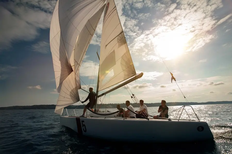 People on sailing yacht in sea. Represent's users of VeryConnect's B boat club software.