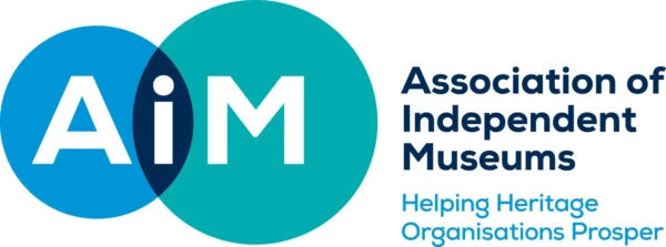 Logo for Association of Independent Museums with the letters AIM in blue and green overlapping circles.