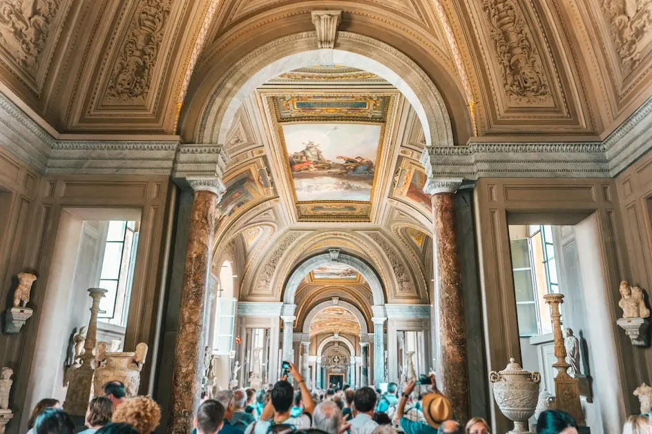 People taking picture of museum ceiling. Represents users of museum membership software.